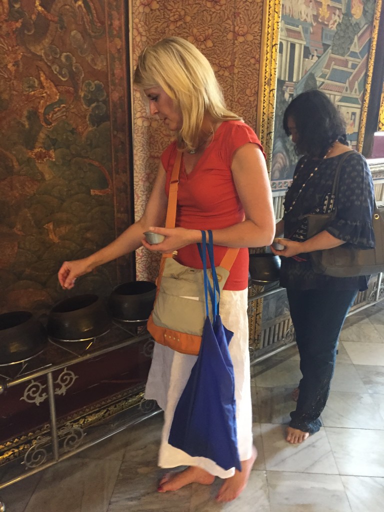 Jen putting coins in bowls 